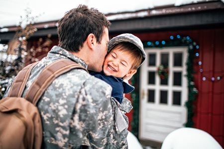 iStock-507577602-military-soldier-with-child-smaller-image.jpg