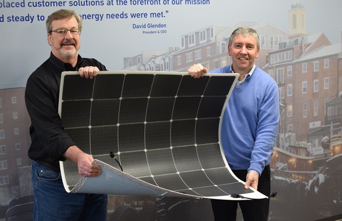 Kevin-Maloney-of-Picktricity-and-David-Glendon-of-Sprague-show-thin-and-flexible-solar-panel-applied-to-Sprague-tank-(1).jpg